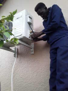 Aircon installers fitting an outdoor unit